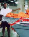 Anthony loading Backpacks for Belize School Children